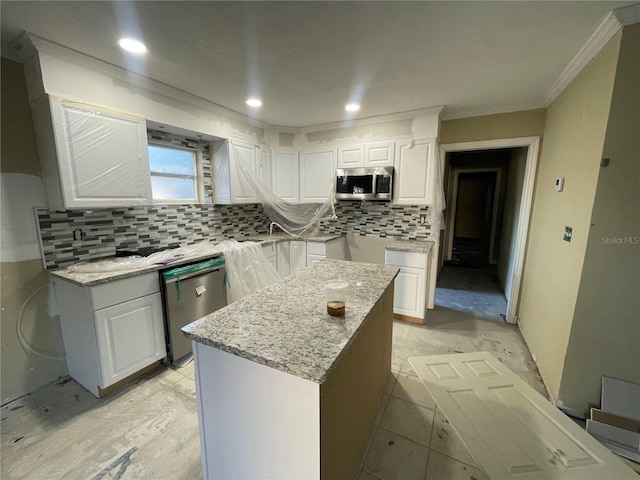 kitchen featuring white cabinetry, stainless steel appliances, and light stone counters