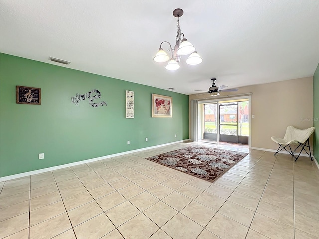 interior space with ceiling fan with notable chandelier