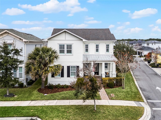 view of front of home with a front lawn