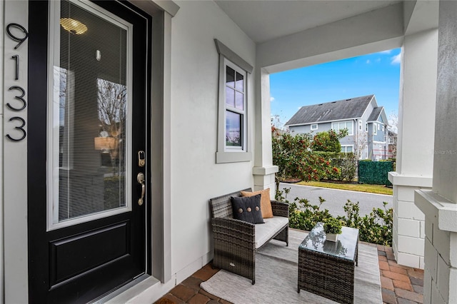 entrance to property featuring stucco siding