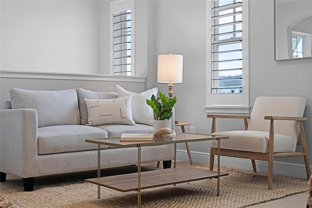 living room featuring a wealth of natural light and baseboards