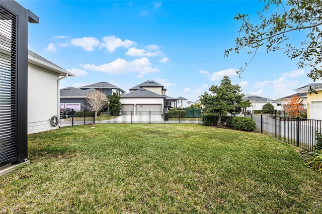 view of yard featuring a residential view and a fenced backyard