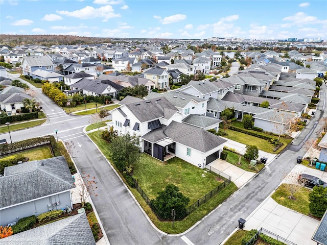 birds eye view of property with a residential view