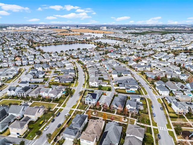 birds eye view of property with a residential view and a water view