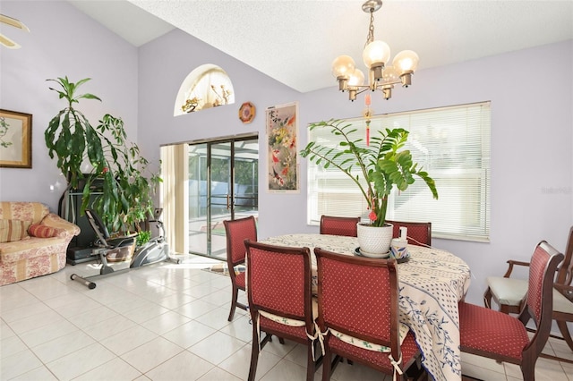 tiled dining space with vaulted ceiling and a notable chandelier