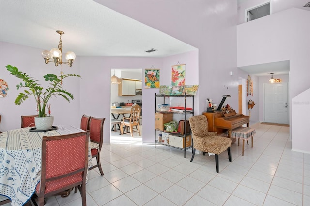 tiled dining room with a notable chandelier