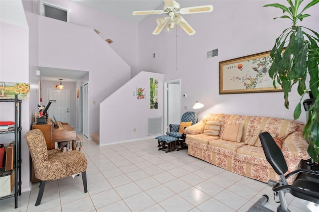 living room featuring light tile patterned floors, high vaulted ceiling, and ceiling fan