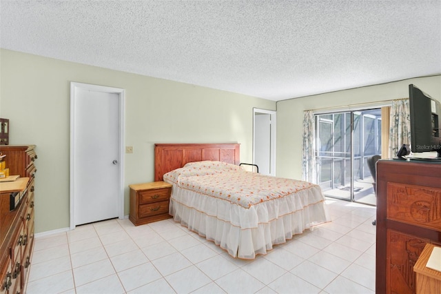 tiled bedroom with a textured ceiling and access to outside