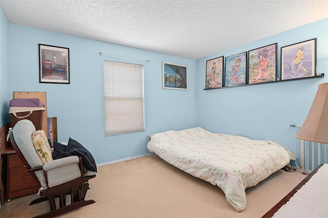 carpeted bedroom featuring a textured ceiling