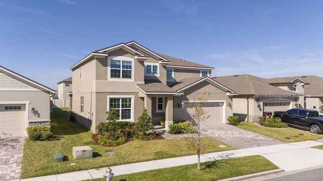 view of front of house with a front lawn and a garage