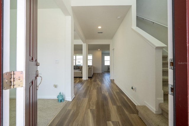 hall with dark hardwood / wood-style flooring