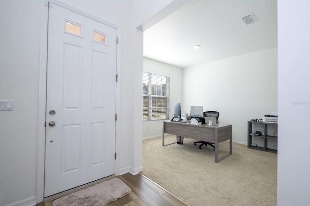 office space with hardwood / wood-style floors