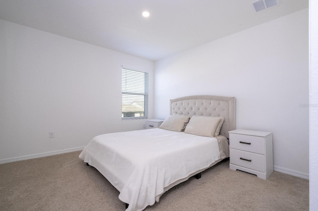 bedroom with light carpet