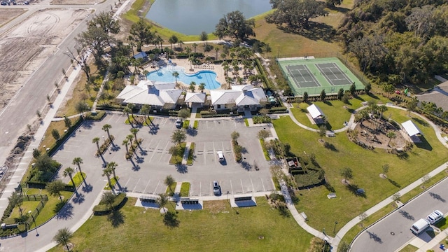 birds eye view of property with a water view