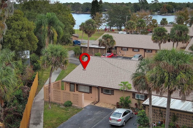 birds eye view of property with a water view