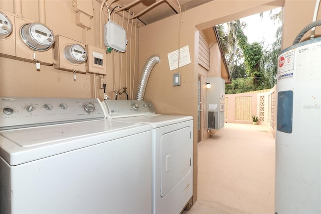 clothes washing area with washer and clothes dryer