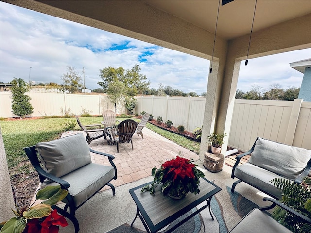 view of patio featuring a fenced backyard and outdoor lounge area