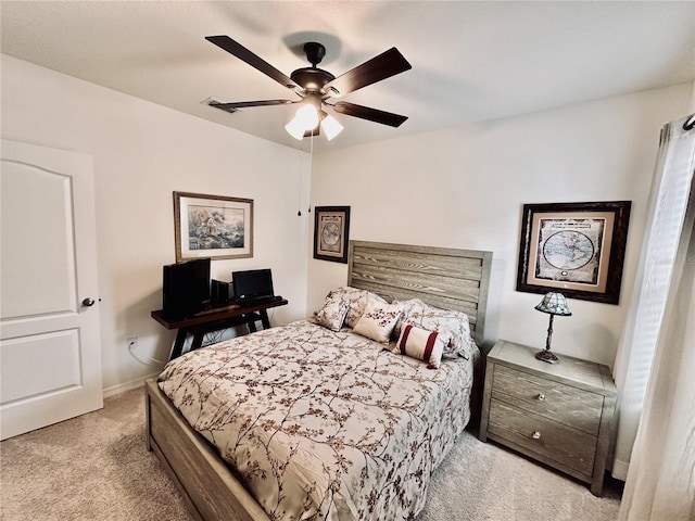 bedroom featuring a ceiling fan, visible vents, and light carpet