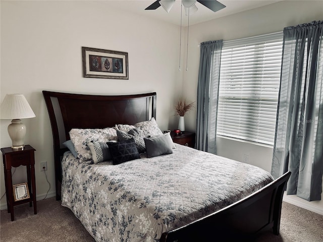 bedroom featuring ceiling fan, baseboards, and carpet floors