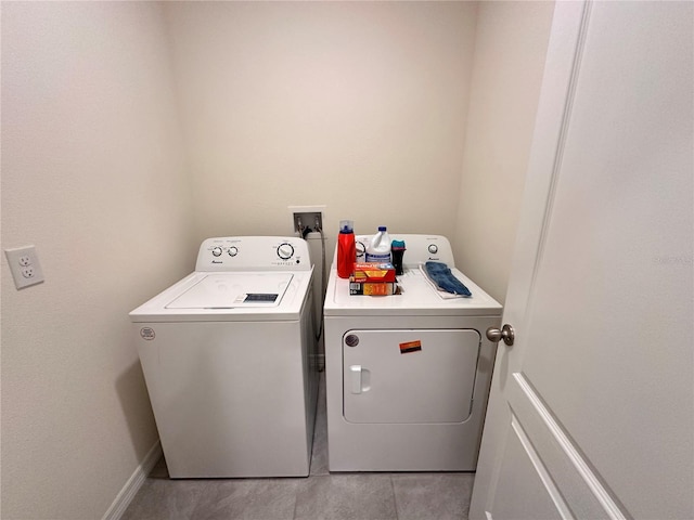 clothes washing area with washing machine and dryer and laundry area