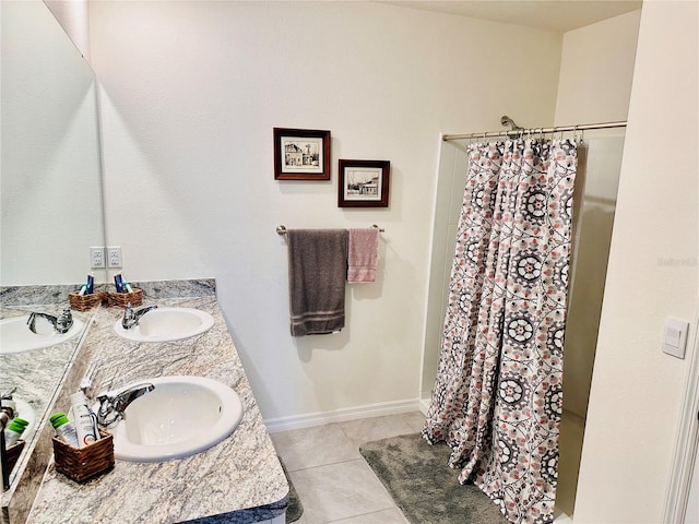 bathroom with a sink, a shower with shower curtain, double vanity, and tile patterned flooring