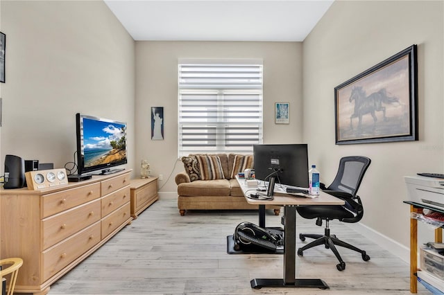 office space with light hardwood / wood-style floors