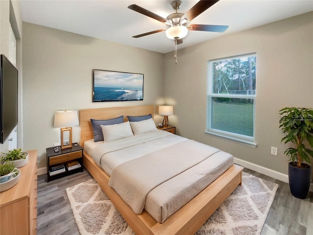 bedroom featuring wood-type flooring and ceiling fan