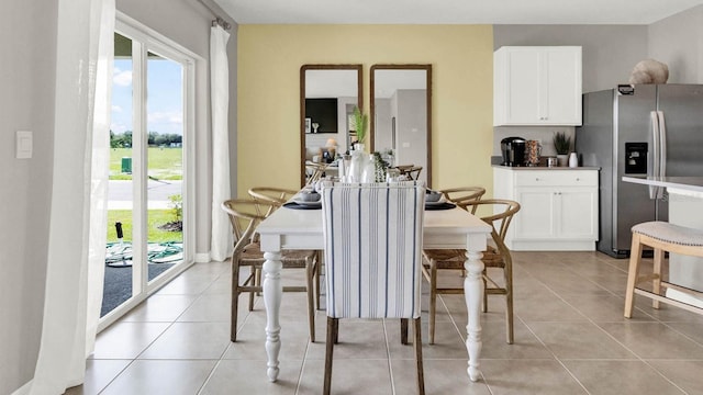 dining space with light tile patterned floors