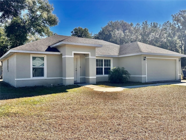 view of front facade featuring a garage and a front yard