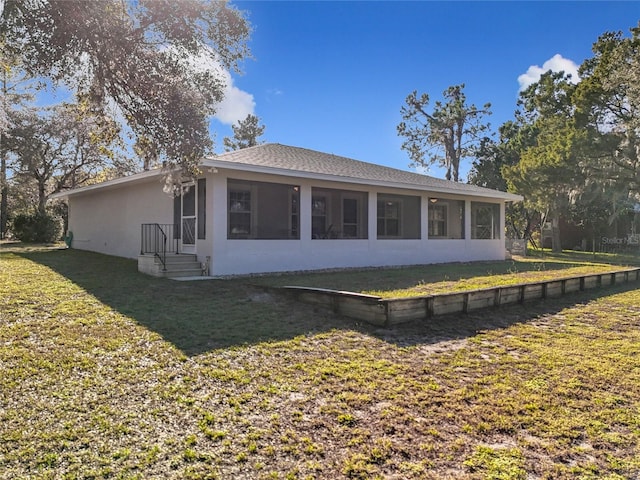 rear view of house with a lawn