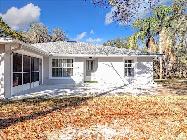 rear view of property featuring a patio area