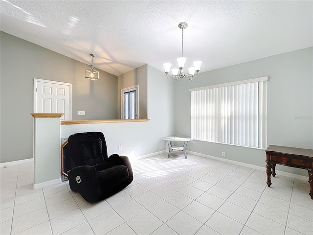 sitting room featuring an inviting chandelier, light tile patterned floors, a textured ceiling, and vaulted ceiling