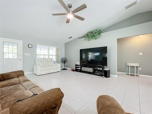 living room featuring ceiling fan, light tile patterned flooring, and lofted ceiling