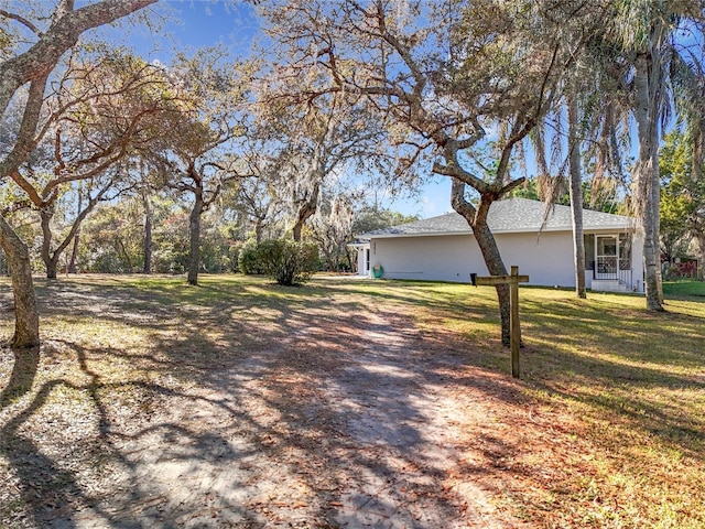 exterior space with a front lawn