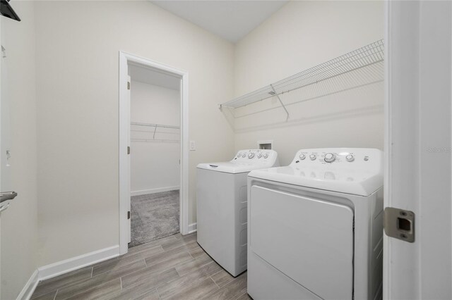 washroom with separate washer and dryer