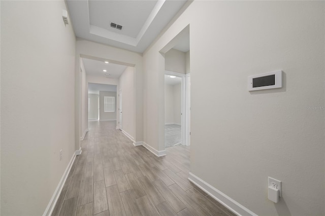 hall with light wood-type flooring