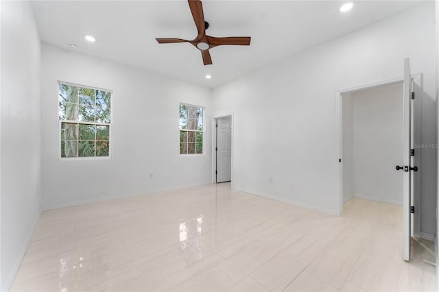 unfurnished room with ceiling fan