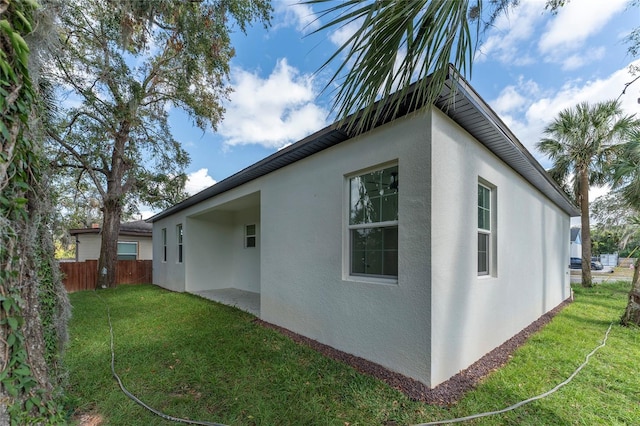 view of property exterior with a yard