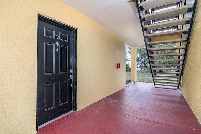 doorway to property featuring a porch