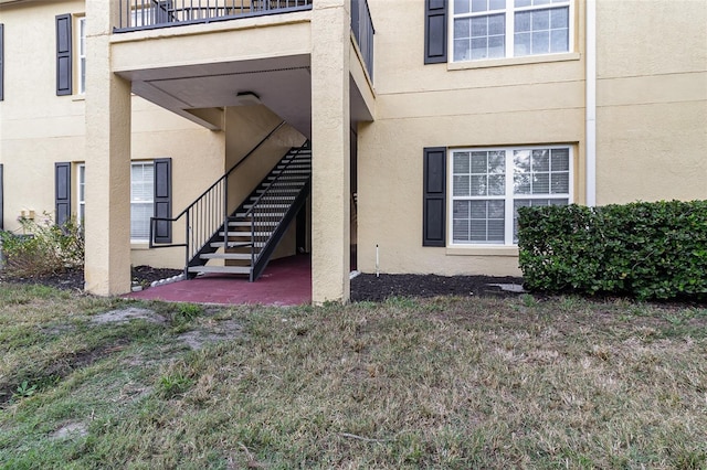 entrance to property with a balcony