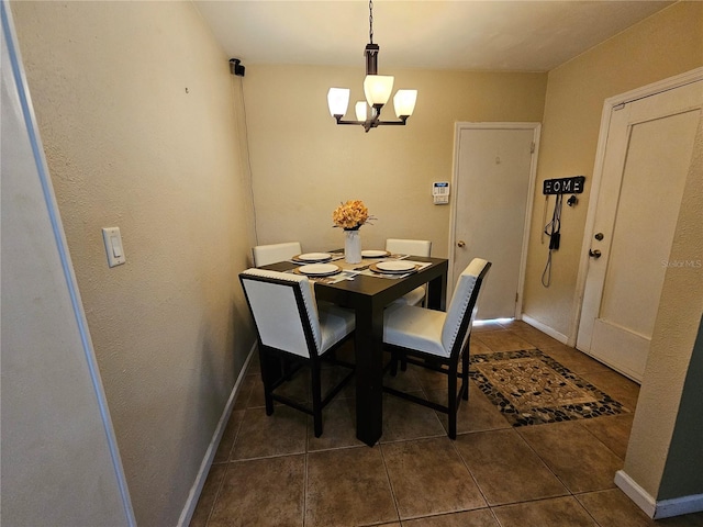 tiled dining area featuring a notable chandelier