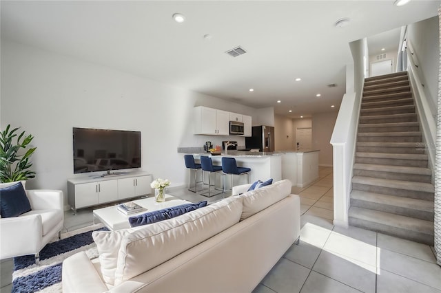 living room with light tile patterned floors