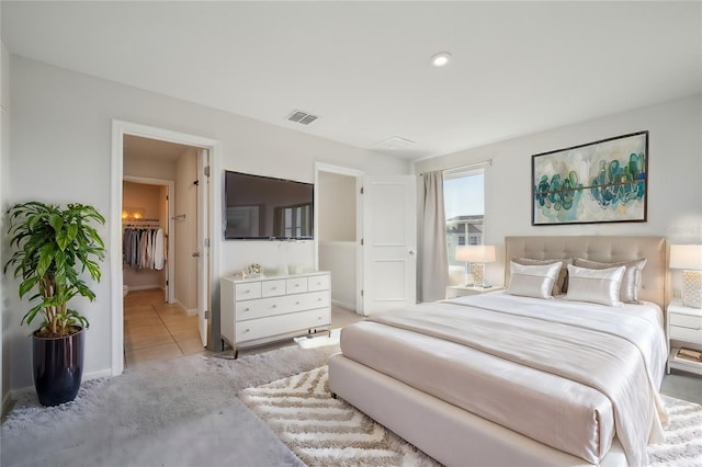 bedroom featuring light colored carpet