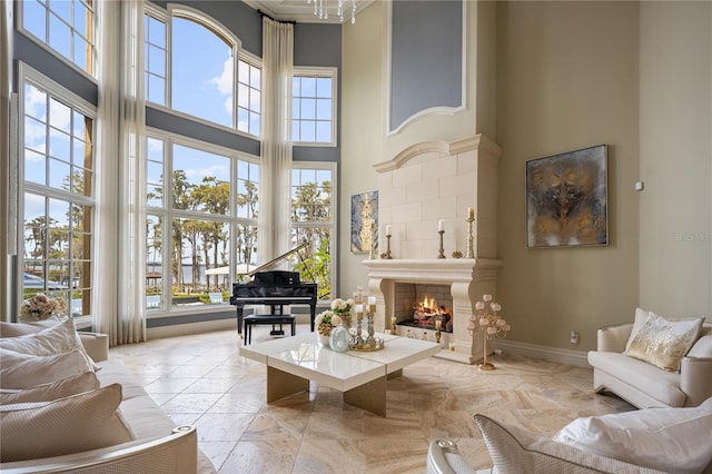 living room with plenty of natural light and a high ceiling