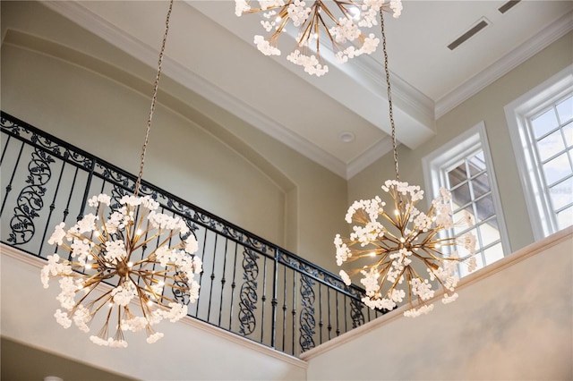 room details featuring crown molding and a notable chandelier