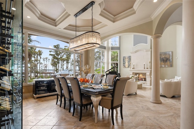 dining space featuring ornate columns, coffered ceiling, crown molding, an inviting chandelier, and beamed ceiling