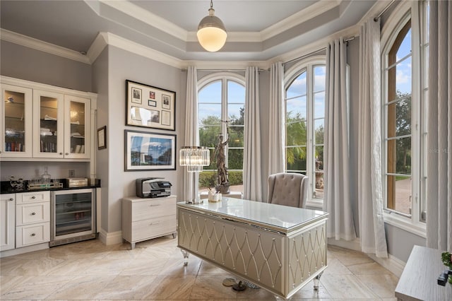 office area with bar area, a raised ceiling, crown molding, beverage cooler, and a chandelier