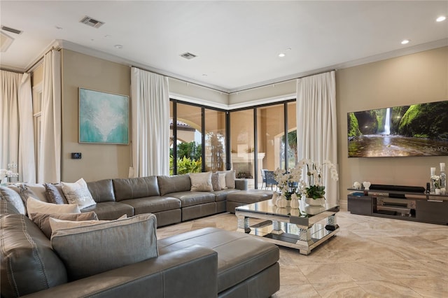 living room featuring crown molding