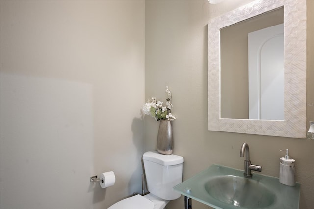 bathroom featuring sink and toilet