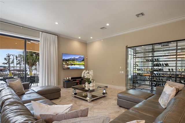 living room featuring crown molding